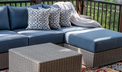 Unique Crafts Outdoor Furniture - Close up of patio furniture in modern screened porch, summertime woods in the background.